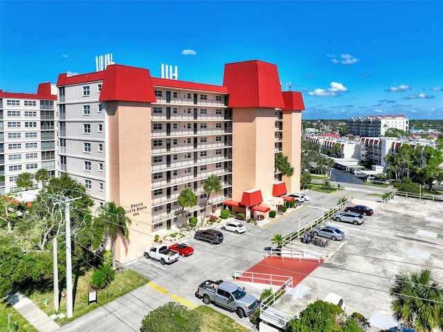 232 Saint Augustine Ave Unit 505, Venice, FL 34285 - view of apartment building / complex with uncovered parking and a city view