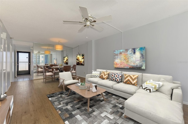 232 Saint Augustine Ave Unit 505, Venice, FL 34285 - living room with hardwood / wood-style flooring, a ceiling fan, and baseboards