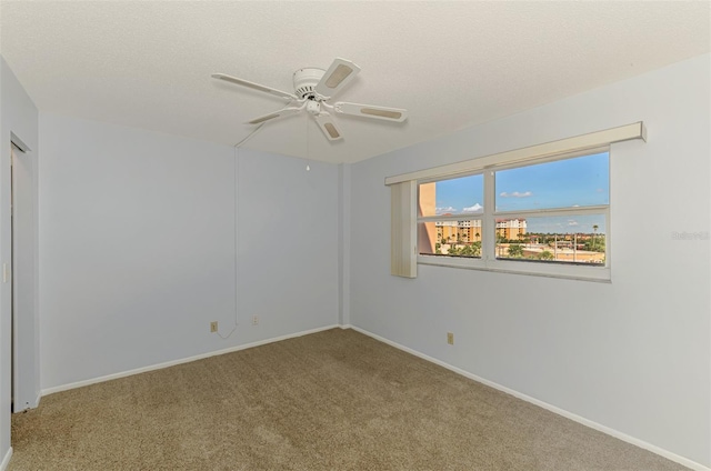232 Saint Augustine Ave Unit 505, Venice, FL 34285 - carpeted spare room with ceiling fan, baseboards, and a textured ceiling