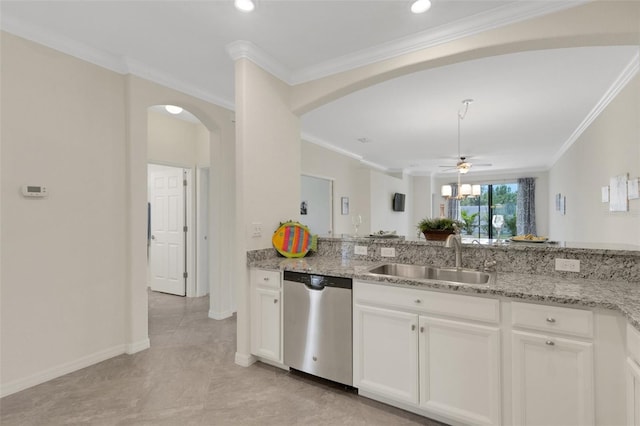 9823 Haze Dr, Venice, FL 34292 - kitchen featuring dishwasher, a sink, arched walkways, light stone countertops, and ornamental molding