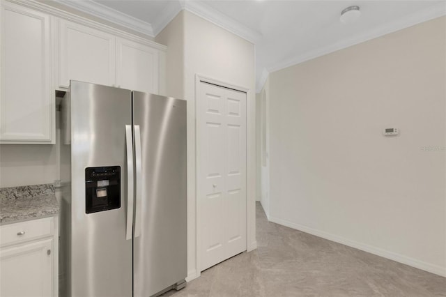 9823 Haze Dr, Venice, FL 34292 - kitchen featuring stainless steel refrigerator with ice dispenser, ornamental molding, white cabinets, light stone counters, and baseboards