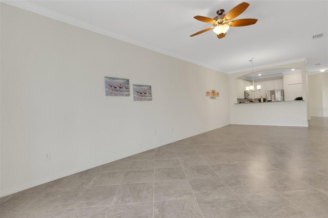 9823 Haze Dr, Venice, FL 34292 - unfurnished living room featuring crown molding, a ceiling fan, and a chandelier
