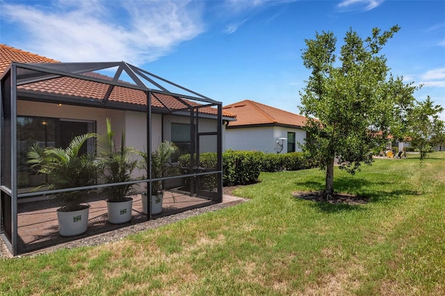 9823 Haze Dr, Venice, FL 34292 - view of grassy yard with a lanai and a patio