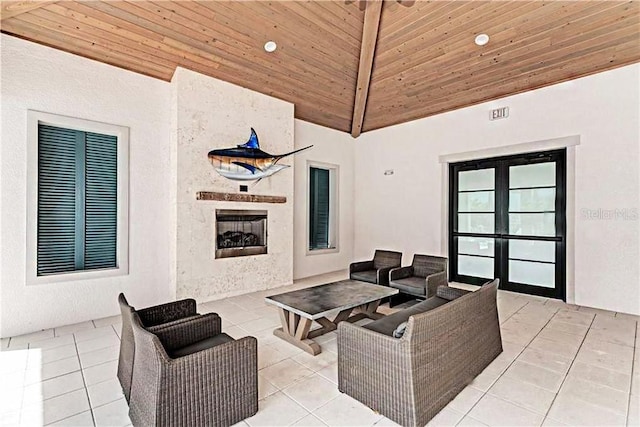 9823 Haze Dr, Venice, FL 34292 - view of patio with an outdoor living space with a fireplace and french doors