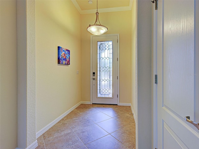 entryway with ornamental molding, light tile patterned floors, and baseboards