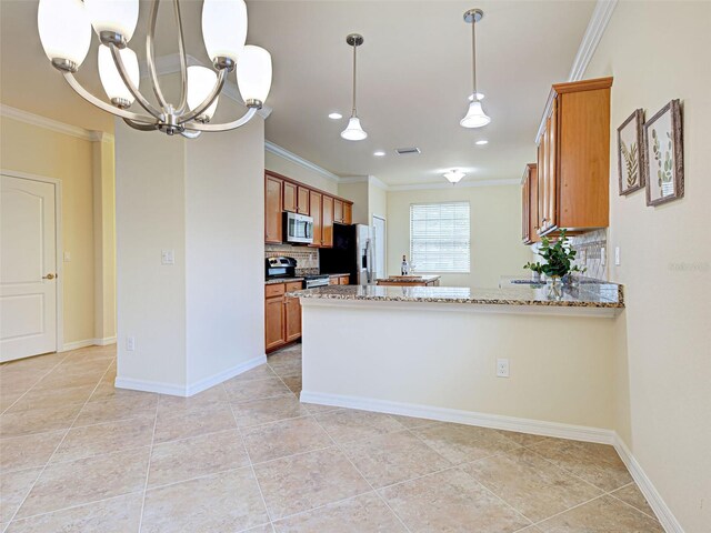 kitchen featuring appliances with stainless steel finishes, backsplash, ornamental molding, brown cabinets, and stone counters