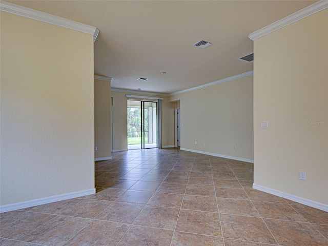 empty room with ornamental molding, baseboards, and light tile patterned flooring