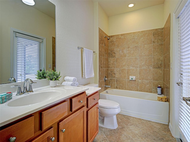 bathroom with shower / bathtub combination, toilet, vanity, and healthy amount of natural light