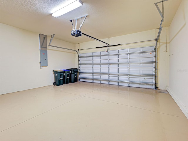 garage with a garage door opener and electric panel
