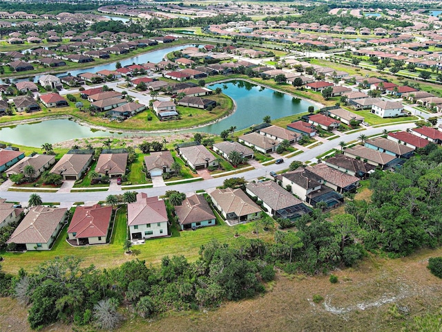 view of property location featuring nearby suburban area and a nearby body of water