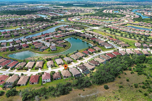 aerial overview of property's location with nearby suburban area and a large body of water