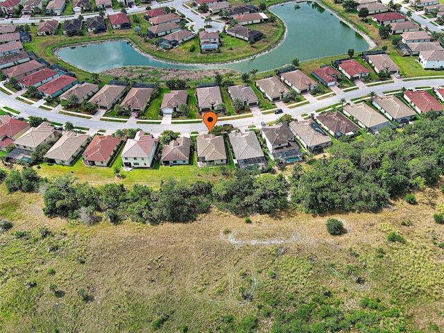 view of property location with nearby suburban area and a large body of water