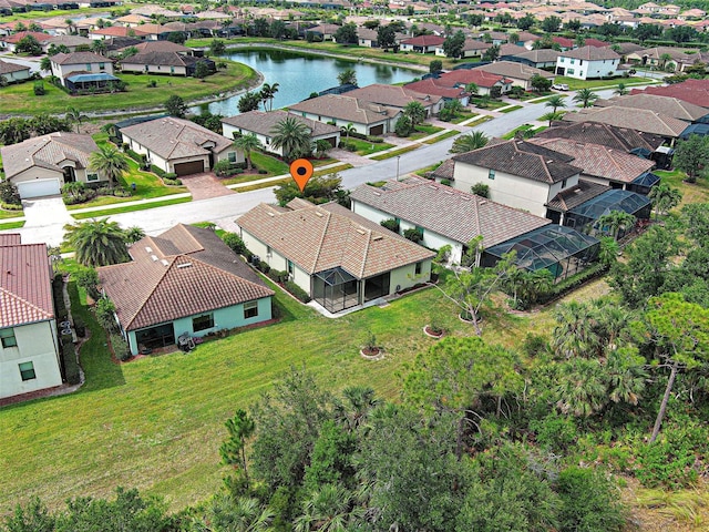 aerial perspective of suburban area featuring a large body of water