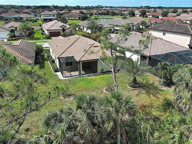 aerial perspective of suburban area featuring a nearby body of water
