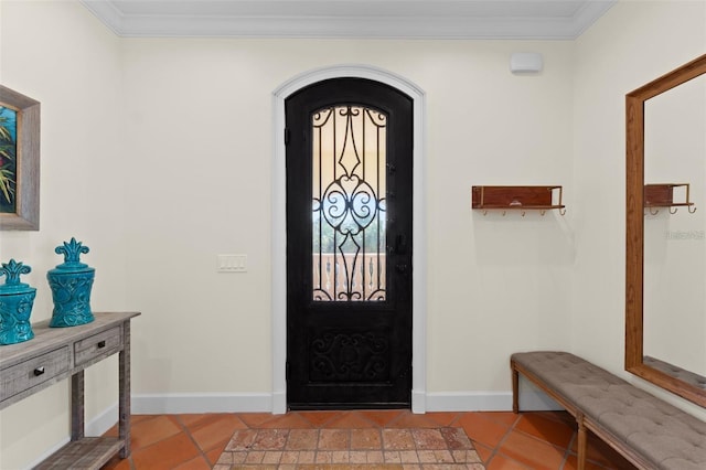63 Palm Dr, Placida, FL 33946 - foyer featuring light tile patterned floors, ornamental molding, baseboards, and arched walkways