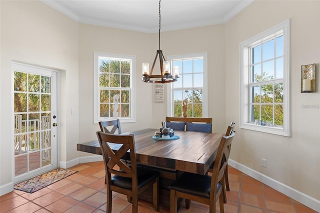 63 Palm Dr, Placida, FL 33946 - dining space featuring a chandelier, crown molding, light tile patterned floors, and baseboards