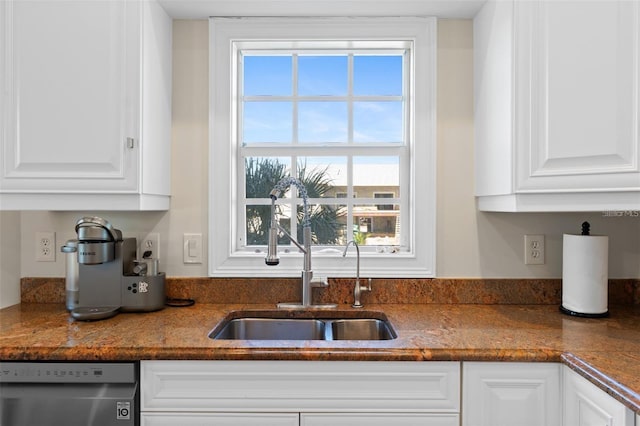 63 Palm Dr, Placida, FL 33946 - kitchen featuring dishwasher, a sink, and white cabinets