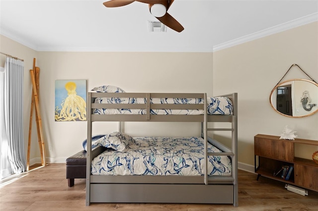 63 Palm Dr, Placida, FL 33946 - bedroom featuring ornamental molding, wood finished floors, baseboards, and a ceiling fan