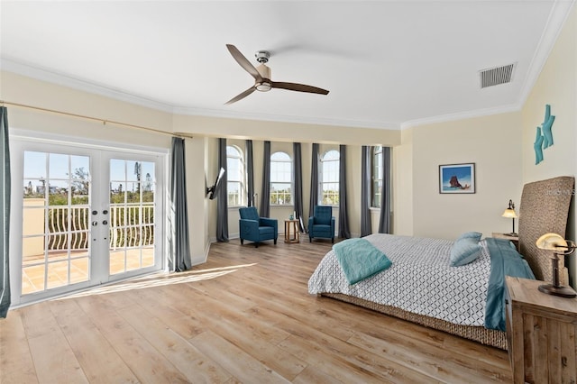63 Palm Dr, Placida, FL 33946 - bedroom with crown molding, french doors, access to outside, light wood finished floors, and ceiling fan