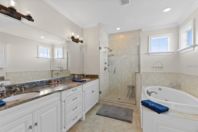 63 Palm Dr, Placida, FL 33946 - full bath with healthy amount of natural light, a stall shower, ornamental molding, double vanity, and a jetted tub