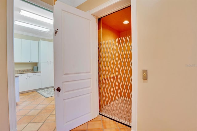 63 Palm Dr, Placida, FL 33946 - hall featuring light tile patterned flooring and elevator