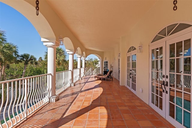63 Palm Dr, Placida, FL 33946 - view of patio with french doors and a balcony