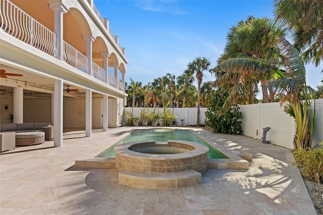 63 Palm Dr, Placida, FL 33946 - view of patio with a ceiling fan, a fenced backyard, a balcony, outdoor lounge area, and a pool with connected hot tub