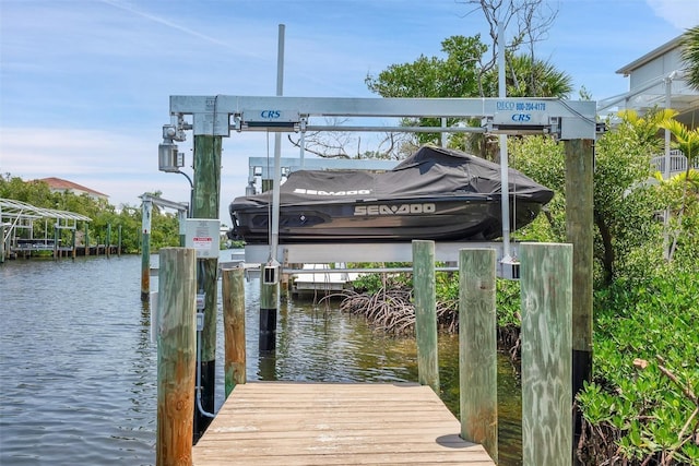 63 Palm Dr, Placida, FL 33946 - dock area with boat lift and a water view