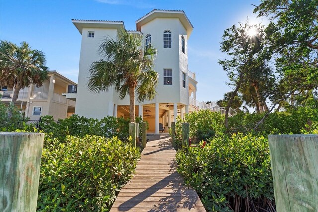 63 Palm Dr, Placida, FL 33946 - view of front facade with stucco siding and ceiling fan