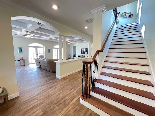 63 Palm Dr, Placida, FL 33946 - stairs featuring ornate columns, ceiling fan, arched walkways, coffered ceiling, and wood finished floors