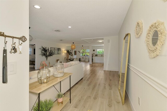 4321 Shamrock Dr, Venice, FL 34293 - corridor featuring light wood-type flooring, recessed lighting, and attic access