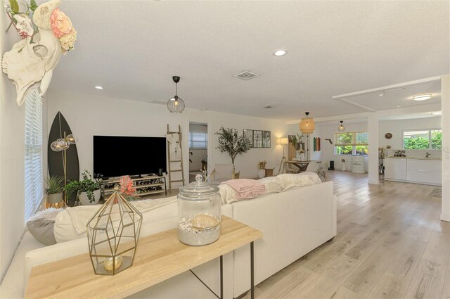 4321 Shamrock Dr, Venice, FL 34293 - living room featuring recessed lighting and light wood-style flooring