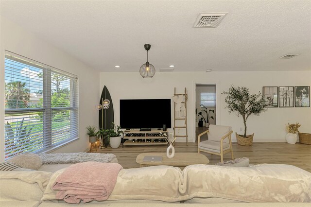 4321 Shamrock Dr, Venice, FL 34293 - living area featuring wood finished floors, recessed lighting, and a textured ceiling