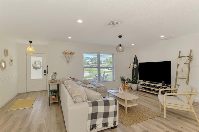 4321 Shamrock Dr, Venice, FL 34293 - living area with light wood-style floors, recessed lighting, baseboards, and a textured ceiling
