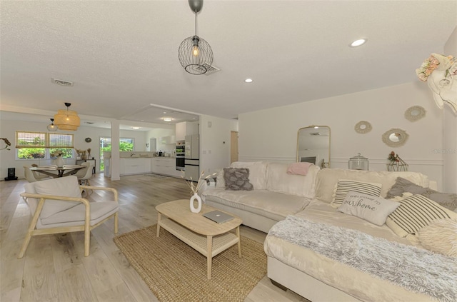 4321 Shamrock Dr, Venice, FL 34293 - living room with light wood-style flooring and recessed lighting