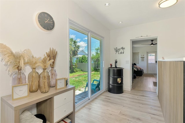 4321 Shamrock Dr, Venice, FL 34293 - doorway with light wood finished floors, a ceiling fan, recessed lighting, and baseboards