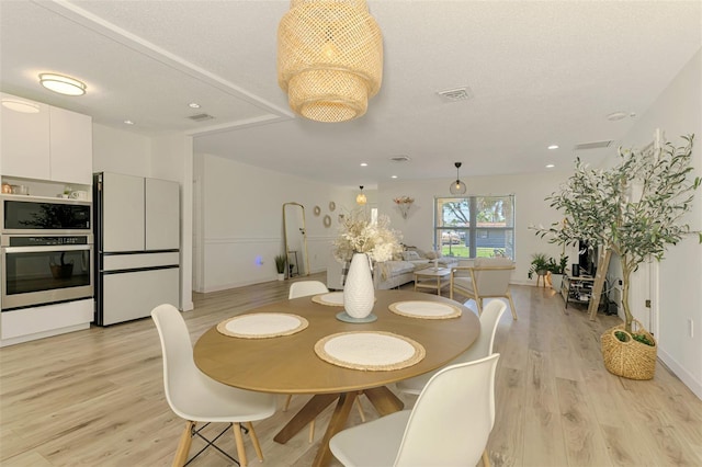 4321 Shamrock Dr, Venice, FL 34293 - dining space featuring light wood-style floors, recessed lighting, and baseboards