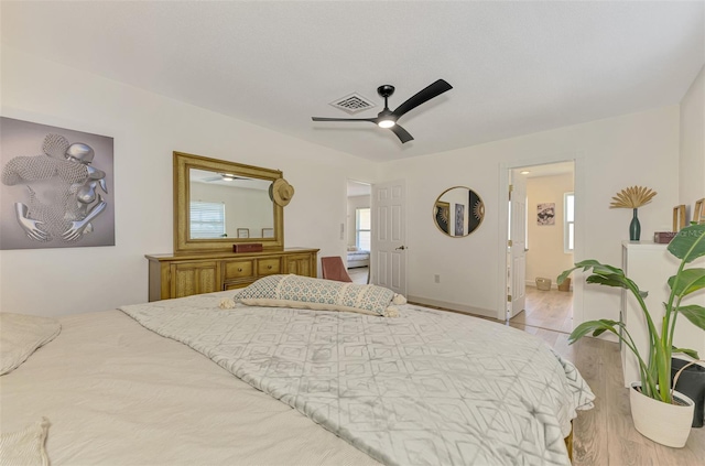 4321 Shamrock Dr, Venice, FL 34293 - bedroom featuring wood finished floors, ceiling fan, and ensuite bath