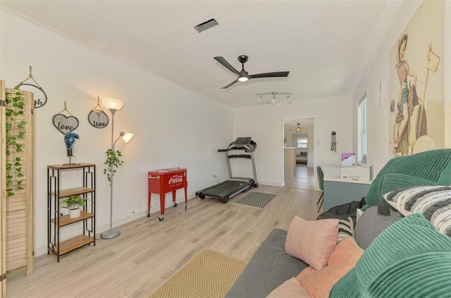 4321 Shamrock Dr, Venice, FL 34293 - workout room with light wood-style flooring, a ceiling fan, baseboards, and track lighting