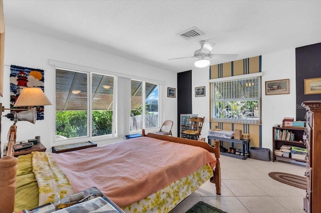 2618 Titania Rd, Englewood, FL 34224 - bedroom with light tile patterned floors and a ceiling fan