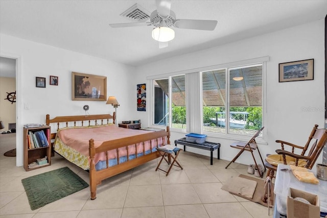 2618 Titania Rd, Englewood, FL 34224 - bedroom featuring light tile patterned floors and ceiling fan