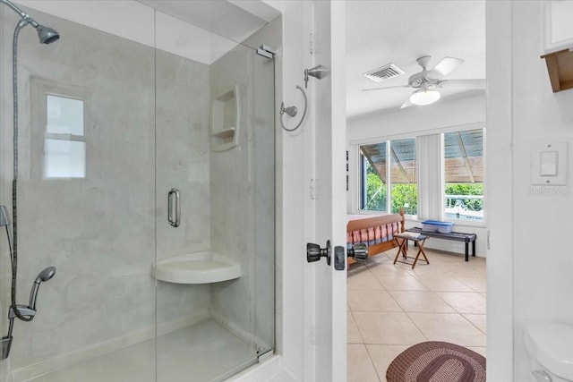2618 Titania Rd, Englewood, FL 34224 - full bathroom with a stall shower, tile patterned floors, and a ceiling fan