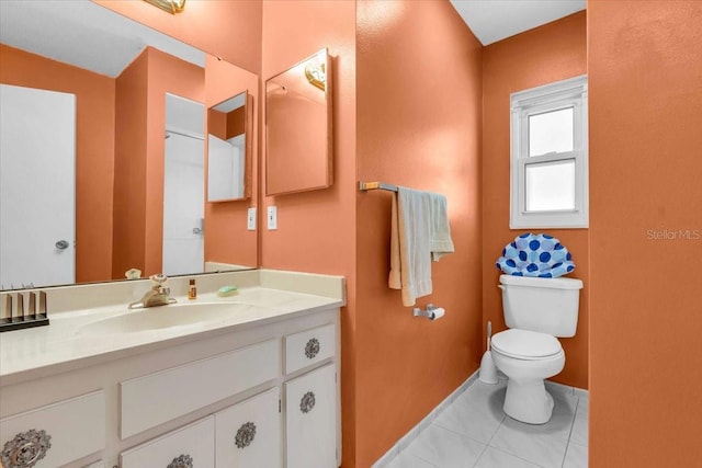 2618 Titania Rd, Englewood, FL 34224 - bathroom with toilet, tile patterned flooring, vanity, and baseboards