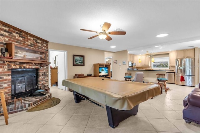2618 Titania Rd, Englewood, FL 34224 - rec room with light tile patterned floors, billiards, ceiling fan, a brick fireplace, and recessed lighting