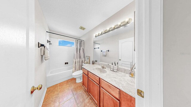 632 Tanana Fall Dr, Ruskin, FL 33570 - full bathroom featuring tile patterned flooring, toilet, vanity, shower / bath combo, and a textured ceiling
