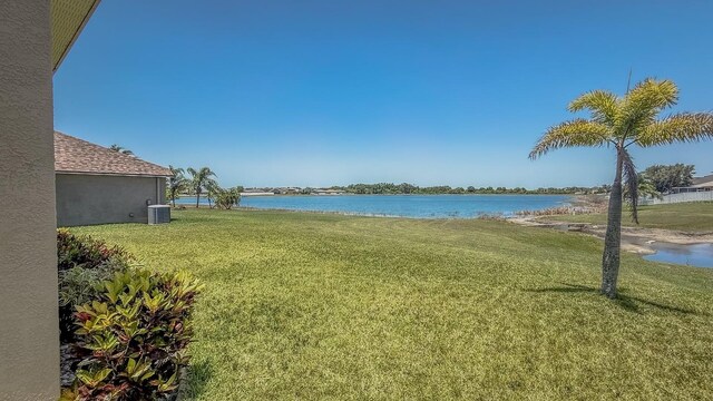 632 Tanana Fall Dr, Ruskin, FL 33570 - view of grassy yard with a water view and cooling unit