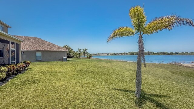 632 Tanana Fall Dr, Ruskin, FL 33570 - view of grassy yard featuring a water view and central AC unit