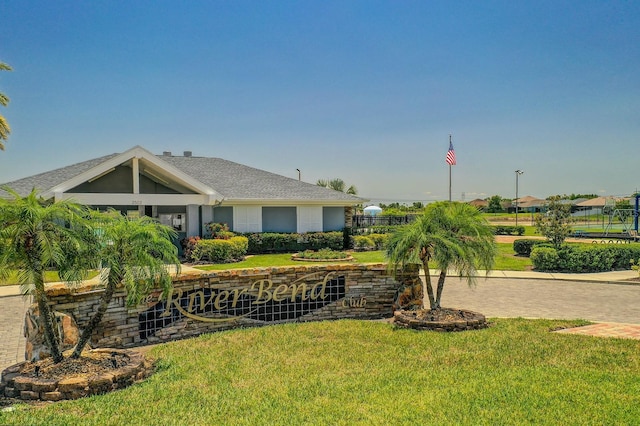 632 Tanana Fall Dr, Ruskin, FL 33570 - view of front of home with a front yard and roof with shingles