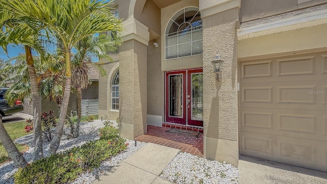 632 Tanana Fall Dr, Ruskin, FL 33570 - entrance to property with stucco siding and a garage