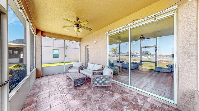 632 Tanana Fall Dr, Ruskin, FL 33570 - sunroom / solarium featuring ceiling fan, plenty of natural light, and lofted ceiling